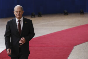 Germany's Chancellor Olaf Scholz speaks on arrival for a EU Summit, at the EU headquarters in Brussels, on March 23, 2023.